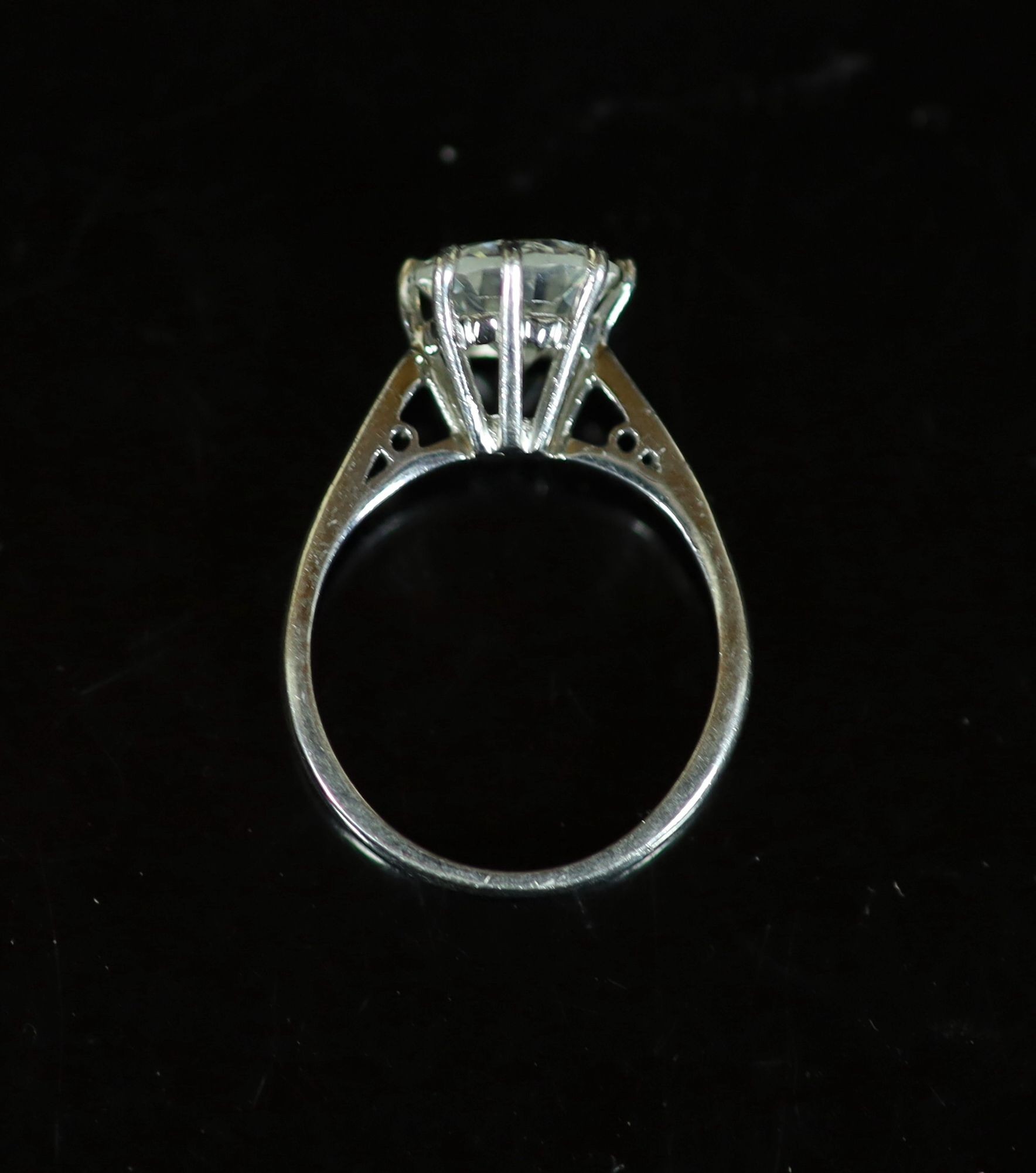 A modern platinum and solitaire diamond ring